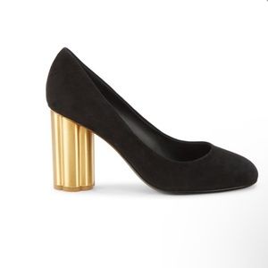 Salvator Ferragamo black suede on a goldtone cylinder heel.